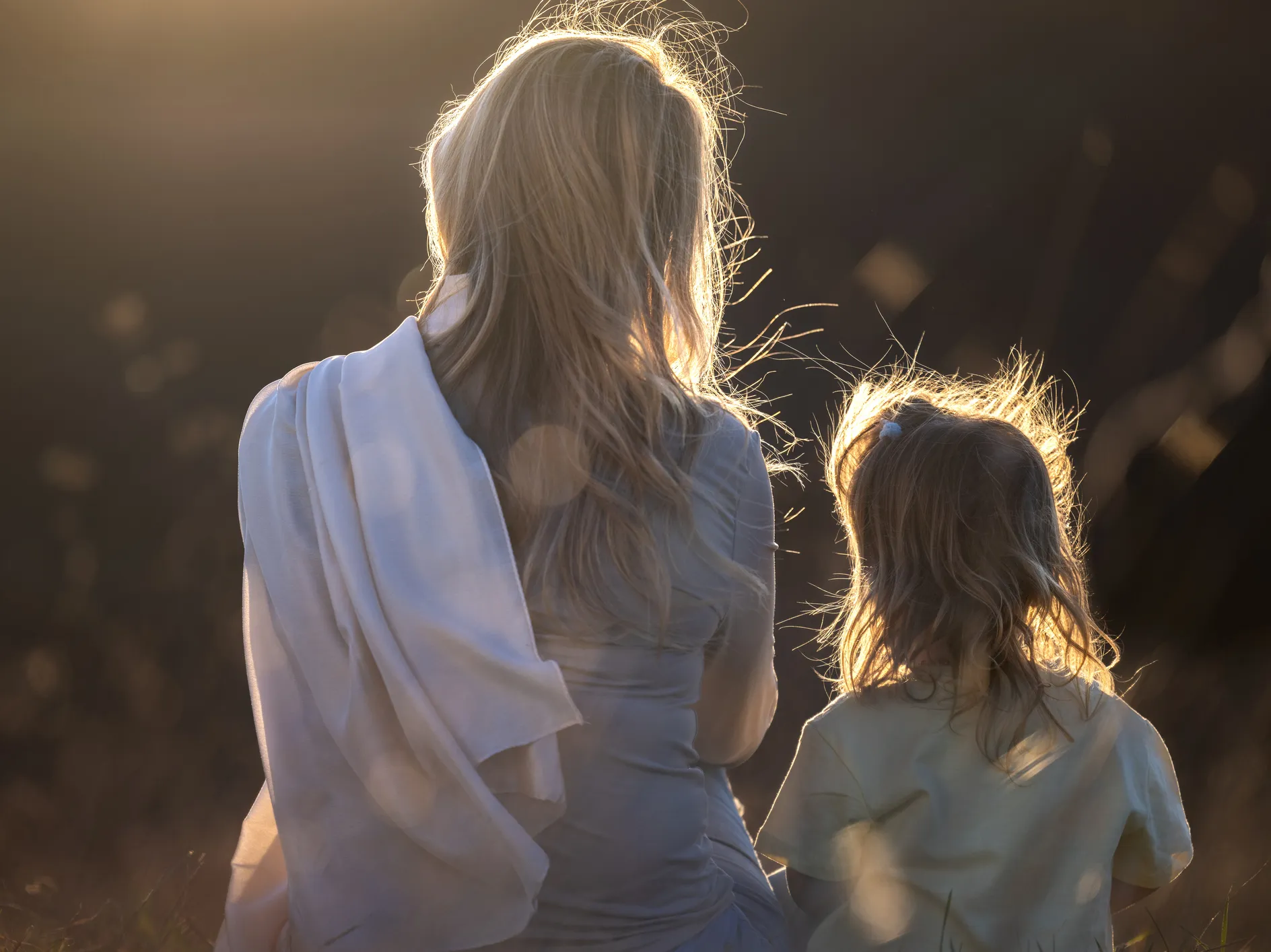 Rear view of a mother and her little daughter